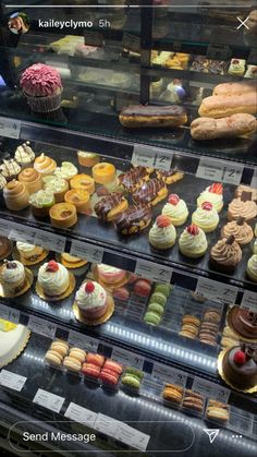 a display case filled with lots of different types of cakes and cupcakes next to each other