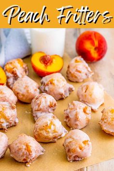 peach fritters are on a cutting board next to some fruit