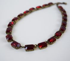 "*A limited selection of my jewelry is available on Etsy. To see my full inventory, please visit my website at www.damesalamode.com.* My MOST requested color! Rich, mysterious, and classic. Garnets have been prized for ages, but came into particular popularity in the 18th and 19th Centuries! These big crystals are vintage Swarovski. Beautifully faceted and wonderfully rich and sparkling! Stone Size: 14x10mm / .55 inches / 1.4cm each Stones: Vintage Swarovski Garnet Crystals Settings: Cast brass Elegant Red Necklace With 17 Jewels, Red Ruby Necklace For Evening, Formal Red Jeweled Necklaces, Handmade Red Necklace For Evening, Red Single Strand Jewelry For Formal Occasions, Elegant Red Single Strand Jewelry, Elegant Red Single Strand Necklace, Formal Red Single Strand Jewelry, Classic Handmade Red Necklace