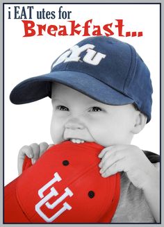 a young boy wearing a hat and holding a baseball cap