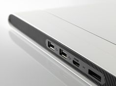 the back side of a laptop computer with two usb ports on it's sides