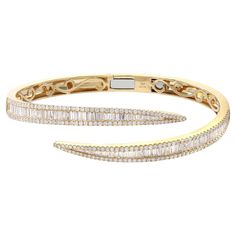 A classic look with easy elegance, this diamond bangle bracelet exudes sophistication. This stunning bracelet is crafted in 18k yellow gold and features channel set baguette cut and round cut diamonds with a total diamond weight of 3.76 carats. Diamond color G-H and VS-SI clarity. It's stackable and easy to wear. Bangle width: 6.2mm. Weight: 25.48 grams. Wrist fit: 6.5 inches. Comes with a presentable gift box and appraisal. Pave Diamond Wedding Bands, Diamond Bangle Bracelet, Bangles Making, Simple Diamonds, Diamond Bangles Bracelet, American Modern, Bangles Style, Fine Jewelry Bracelets, Diamond Bangle