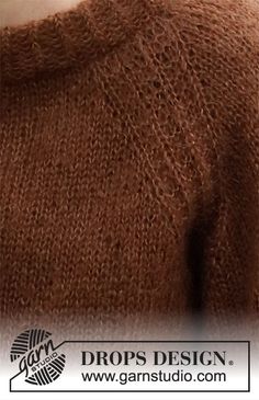 the back of a brown sweater with an open neck and buttons on the chest,