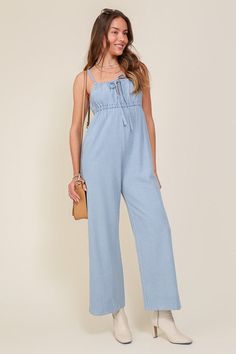 THE PERFECT MIX OF FLIRTY AND FUN, THIS JUMPSUIT IS READY FOR ANY SUMMER OCCASIONS. THE FLOWY SILHOUETTE IS COMPLEMENTED BY A SQUARE NECK LINE, RUCHED BUST, AND FRONT KEYHOLE DETAILS. WHETHER YOU ARE SIPPING COCKTAILS OR DANCING THE NIGHT AWAY, THIS DENIM BLUE JUMPSUIT WILL HAVE YOU FEELING THE BEST.* SLEEVELESS DESIGN* SPAGHETTI STRAP* SELF FRONT TIE* FRONT KEY HOLE* LIGHTWEIGHT MATERIAL* THE MODEL IS 5'9" AND WEARING SIZE SMALLMade In: ChinaFabric Contents: 90% cotton 10% viscoseSize Measureme Jumpsuit Fitted, Blue Jumpsuit, Jumpsuit Summer, Blue Jumpsuits, Hand Knitted Sweaters, Tie Sleeve, Sleeveless Jumpsuits, Denim Jumpsuit, Sheer Fabrics