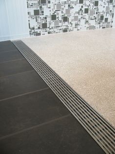 a tile floor with grate lines on it