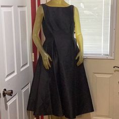 Nwt Elegant Black Dress. Size 10. Sleeveless Tea Length Dress. Back Zipper. V-Neck In Back. Rounded Neck In Front. Two Layers Of Lining In The Skirt. Never Been Worn. Formal Sleeveless Dress With Pleated Back, Dressy Sleeveless Midi Dress For Dinner, Sleeveless Midi Dress With Pleated Back For Evening, Elegant Sleeveless Lined Dress For Party, Elegant Lined Sleeveless Dress For Party, Dressy Sleeveless Midi Dress With Flattering Silhouette, Elegant Black Lined Sleeveless Dress, Sleeveless Lined Midi Dress For Evening, Formal Sleeveless Lined Midi Dress