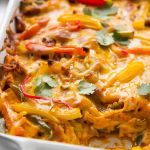 a casserole dish with meat and vegetables in it