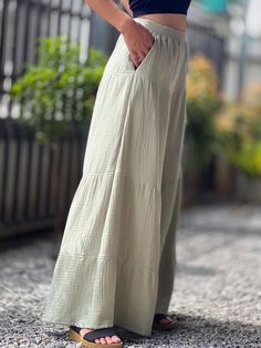 With a subtle texture unique to double gauze fabric, these pants exude a casual yet sophisticated look that can be dressed up or down. Side pockets add a functional touch, keeping essentials close at hand. Whether you're running errands, enjoying a day out, or unwinding after a long day, these muslin pants are your go-to choice for a blend of luxury and practicality. Pair them with a simple tee or a flowy blouse to complete your chic, laid-back ensemble. Size XS Waist 26 Hip 36" Long 38" Size S Chic Linen Bottoms In Solid Color, Chic Solid Color Linen Bottoms, Chic Cotton Harem Pants With Pockets, Chic Full-length Harem Pants With Pockets, Muslin Pants, Womens Trousers, Double Gauze Fabric, Simple Tees, Womens Pants