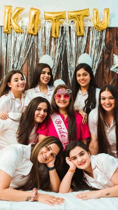 a group of young women posing for a photo