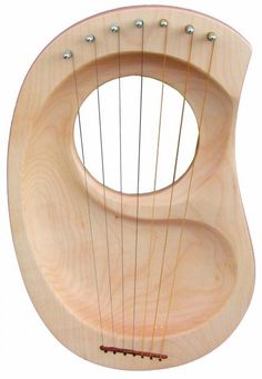 a small wooden instrument with strings attached to it's body and an oval hole in the middle