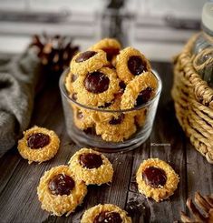 some cookies are in a glass bowl on a table