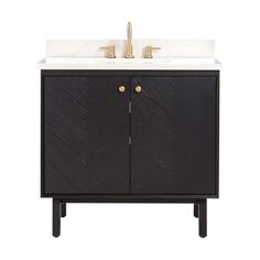 a black and white sink cabinet with two gold faucets