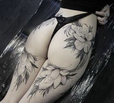 a woman's thigh with flowers on it