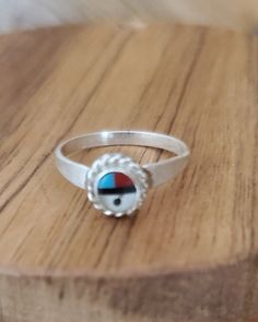 Zuni jewelry gods eye ring. This tiny ring is a beautiful example of a kachina ring. It is minimalist in nature and works well as a pinky ring or as jewelry for children. The tiny eye of god Zuni style jewelry is dainty and easy to wear. The sun face jewelry symbolizes the idea of 'seeing and understanding that which is unknown and unknowable. This ring would make a great gift for a child, a niece, a daughter or a unique pinky ring for yourself. Check out the other listings in my Etsy shop to fi Eye Of God, Face Jewelry, Pinky Rings, Face Jewellery, Gods Eye, Zuni Jewelry, Sun Face, Tiny Rings, Southwestern Jewelry