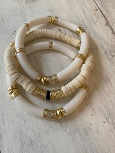 Wow This set is stunning! Ivory and creams, neutrals and just so chic! Set of 2 or three- Set of 2 is the Heishi with one ivory tube bangles Set of 3 is the Heishi with two ivory tube bangles Sizes Small 6.5 Medium 7 Large 7.5 Let me know if you need a larger size- these bracelets do run small- they also stretch. If you like things loose and you are a small worst size 6.5 go up to a 7, if you like things more snug, stick to your true size 6.5 Fall Bracelets, Heishi Bracelets, Stackable Beaded Bracelets, Preppy Bracelets, Tube Bracelet, Polymer Clay Bracelet, Bangles Set, Clay Bracelet, Diy Bracelet Designs