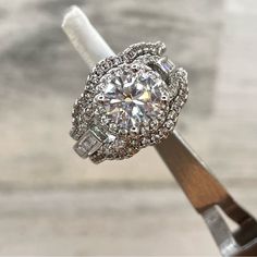 a diamond ring on top of a piece of wood