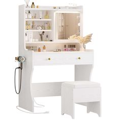 a white dressing table with drawers and stools in front of it, next to an open medicine cabinet