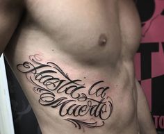 a man's chest with the words tattoo on it