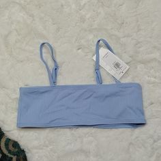 Brand New With Tags Old Navy Blue Ribbed Bikini Swim Top Girls Size Large Ribbed Tops For The Beach, Light Blue Seamless Tops For Beach, Light Blue Seamless Top For Beach, Casual Ribbed Swimwear For Swimming, Trendy Blue Swimwear With Adjustable Straps, Casual Ribbed Swimwear For Pool, Trendy Ribbed Swimwear For The Beach, Light Blue Seamless Swimwear For Spring, Navy Blue Swimsuit Bikinis