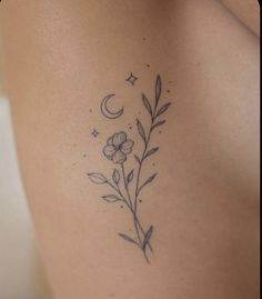 a woman's stomach with flowers and stars on it