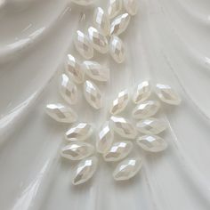 several pieces of white glass sitting on top of a table