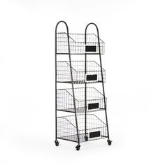 a metal rack with four baskets on wheels and two black bins attached to it