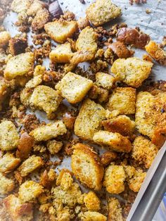 homemade croutons with sliced bread on a baking sheet