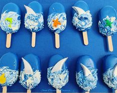 there are many blue and white lollipops with stars on them