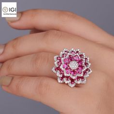 Flower Ring Made in 18kt Gold Studded With VVS Lab Grown Diamonds, Gift for her, Big Jewelry, Giant Ring, Birthday/Anniversary Custom Gift | New Arrival Earth Friendly Diamond Jewelry Collection of Devam Jewels | Anniversary Ring | Wedding Ring ✥ 𝐑𝐢𝐧𝐠 𝐃𝐞𝐭𝐚𝐢𝐥𝐬 ● Ring Top Size : 28mm ● Ring Weight : 11mm  ● Diamond Details :  → Shape: Round Cut  → Type: Lab Grown Diamond → Certificate: IDGL Certified → Diamond Quality: VS1 →Diamond Color: E → Total No. of Diamond: 154 → Lab Diamond Weig Luxury Flower Shaped Jewelry For Anniversary, Luxury Flower Ring With Halo Setting For Gift, Flower Shaped Diamond Ring For Anniversary, Luxury Flower Shaped Diamond Ring Gift, Elegant Flower Shaped Ruby Ring For Anniversary, Dazzling Gia Certified Ruby Ring As Gift, Gia Certified Ruby Ring For Wedding, Exquisite Gia Certified Ruby Ring Gift, Gia Certified Fine Jewelry Ruby Ring