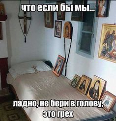 there is a bed with pictures on the wall