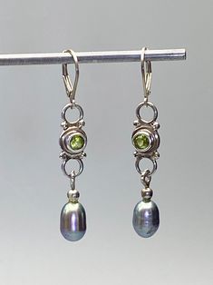 Simple design and wonderfully complimenting Pearls and Peridot are used to create these unique drop earrings. Elegant Peridot Earrings For Anniversary, Elegant Peridot Earrings With Ear Wire, Elegant Peridot Dangle Earrings, Green Fusion Dangle Earrings, Elegant Oval Peridot Earrings, Elegant Peridot Earrings, Unique Drop Earrings, Tucson Az, Tucson