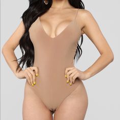 Product Details Mocha Size Medium V Neck Spaghetti Straps Made In Usa Snap Closure 96% Polyester 4% Spandex Imported Beige Sleeveless Bodysuit For Party, Trendy Brown Bodysuit For Night Out, Chic Beige Lined Bodysuit, Beige Stretch Bodysuit For Night Out, Stretch Beige Bodysuit For Night Out, Beige One-piece Bodysuit For Party, Elegant Brown Summer Bodysuit, Trendy Brown Summer Bodysuit, Elegant Brown Bodysuit For Summer