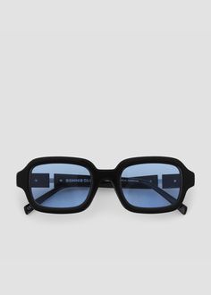 Thick squared acetate frames. Split temples with exposed stainless steel core wire. Black frames with blue lenses. Blue Lense Sunglasses, Designer Sunglasses Aesthetic, Frameless Glasses, Fun Sunglasses, Glasses Inspiration, Shy Guy, Bonnie Clyde, Blue Glasses, Cool Glasses