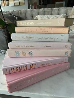 a stack of books sitting on top of a table