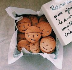 some cookies are in a white box with writing on it