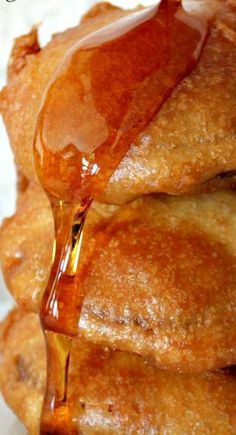 a stack of donuts covered in caramel syrup