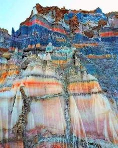 an artistic photograph of the grand canyons and mountains in arizona, usa with layers of colored rock