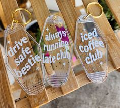 three clear acrylic keychains that say, arrive, running, iced, bestie, and coffee club