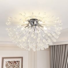 a chandelier hanging from the ceiling in a living room