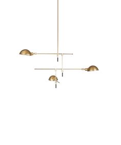 three lights are hanging from the ceiling in an elegant style with gold fixtures and metal fittings