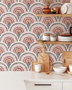 a kitchen counter with plates and bowls on it