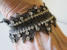 SWAROVSKI STRETCH BRACELET This bracelet is simply elegant! Made of a zillion tiny steel gray beads and gorgeous sparkling prong set rhinestones. 7 inch bracelet with some stretch. It feels like lace fringe. So perfect for any dressy occasion. In excellent vintage condition! Would make a beautiful gift. Elegant Silver Stretch Bracelet With Bling, Elegant Rhinestone Stretch Bracelet For Party, Elegant Adjustable Stretch Bracelet With Rhinestones, Elegant Adjustable Rhinestone Stretch Bracelet, Vero Beach Fl, Grey Beads, Vero Beach, Silver Cuff Bracelet, Silver Cuff