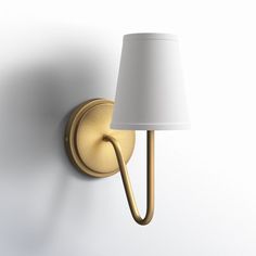 a wall light with a white shade on it's side and a gold arm