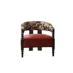 an upholstered chair with floral fabric and wooden legs, against a white background