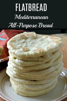 a stack of flatbreads sitting on top of a white plate