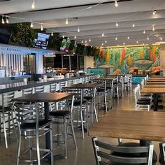 the inside of a restaurant with tables and chairs