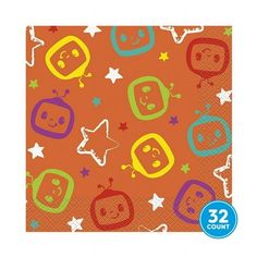 an orange paper napkin with cartoon faces and stars on the front, in various colors