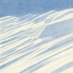 a man riding skis down the side of a snow covered slope