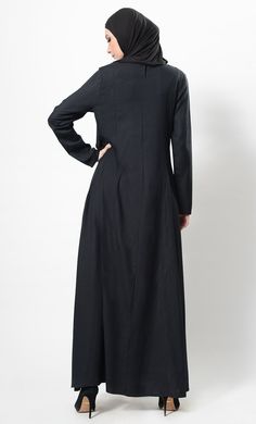 Featuring a classic comfortable flared full length abaya dress in rayon fabric adorned with three striped panels and metallic button studded detail on the yoke. It has pleated panels all over the skirt with an asymmetrical comfortable silhouette to be worn casually during the day.FIT : Relaxed fit.COMPOSITION : Rayon.CARE : Dry clean only. Long Sleeve Abaya With Modesty Panel For Fall, Fall Long Sleeve Abaya With Modesty Panel, Spring Abaya With Modesty Panel, Modest Maxi Length Abaya For Fall, Fall Modest Maxi Length Abaya, Fall Season Modest Maxi Length Abaya, Elegant Abaya With Modesty Panel For Fall, Modest Long Abaya For Fall, Elegant Fall Abaya With Modesty Panel