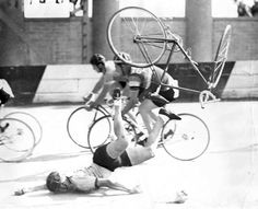 an old black and white photo shows men on bicycles being tossed over by another man